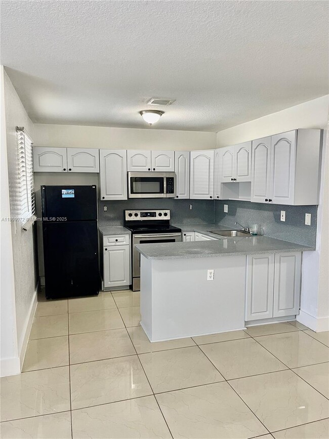 property at 5857 NW 13th Ave