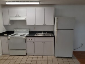 1841 Hacienda Way, Unit Apy C in Holiday, FL - Building Photo - Building Photo