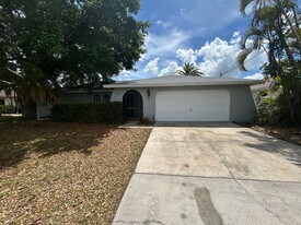 Freshly painted interior and new carpet in living room spacious home off Country Club Blvd in Cape Coral, FL - Building Photo