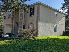 5731 white Trillium Loop in Land O Lakes, FL - Building Photo