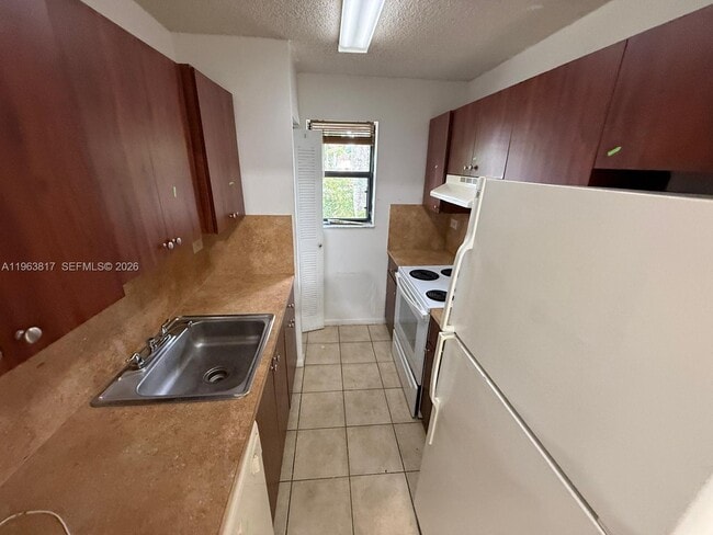 property at 6975 NW 179th St