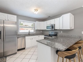 1590 Dinnerbell Ln E in Dunedin, FL - Building Photo - Building Photo