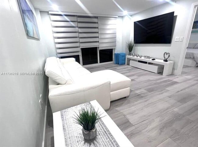 property at 6917 Collins Ave