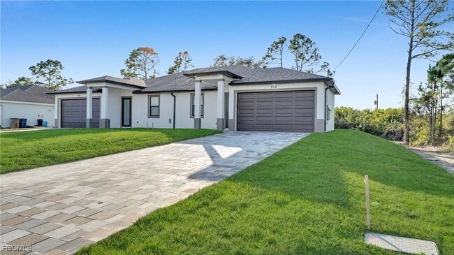 704 Homer Ave S in Lehigh Acres, FL - Building Photo - Building Photo