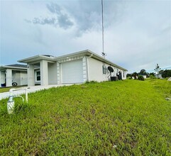 1110 Augusta St E in Lehigh Acres, FL - Building Photo - Building Photo