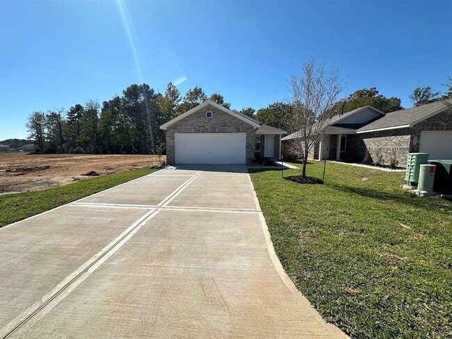 644 Falling Cave Dr in Willis, TX - Foto de edificio - Building Photo