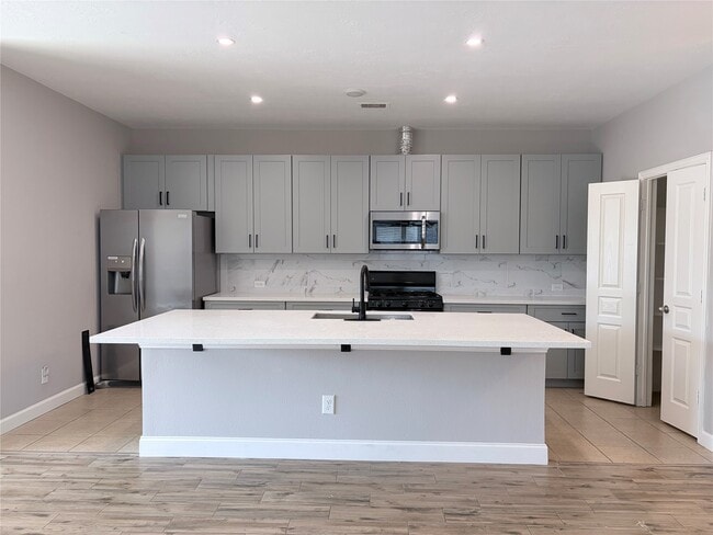 10910 Woodwind Shadows Dr