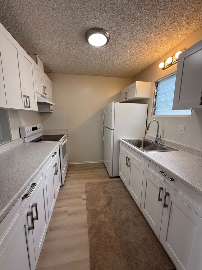 property at 98-1080 Komo Mai Dr