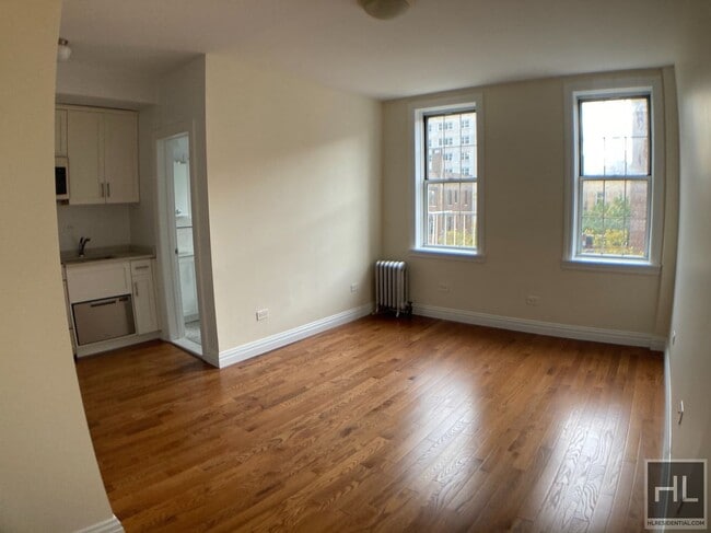 property at 117 W 13th St