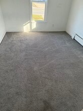 406 E Broad St, Unit Apartment 1 in Chesaning, MI - Building Photo - Building Photo