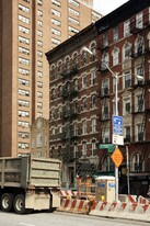 110-112 E 1st St in New York, NY - Building Photo