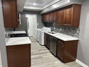 10246 Prince Pl, Unit 108 in Largo, MD - Building Photo - Building Photo