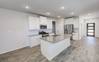 196 Pepperbark Loop in Mustang Ridge, TX - Building Photo - Building Photo