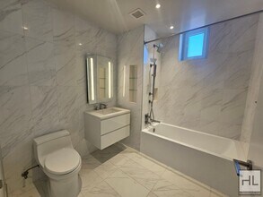 Modern 1-Bedroom with Private Balcony | Ea in New York, NY - Building Photo - Building Photo