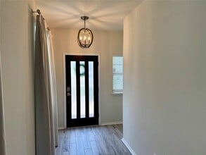 546 Pepperbark Loop in Mustang Ridge, TX - Building Photo - Building Photo