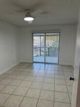 128 Lehane Ter, Unit 205 in North Palm Beach, FL - Foto de edificio - Building Photo