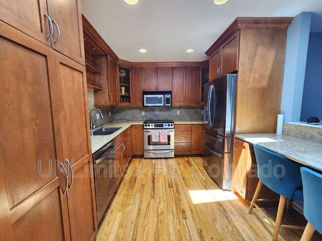 8308 E Lehigh Dr in Denver, CO - Building Photo - Building Photo