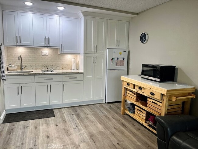 24055 Paseo Del Lago, Unit 201 in Laguna Woods, CA - Building Photo - Building Photo