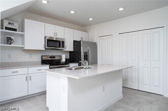 14267 Oviedo Pl in Tice, FL - Building Photo - Building Photo