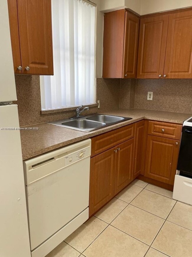 property at 6065 NW 186th St