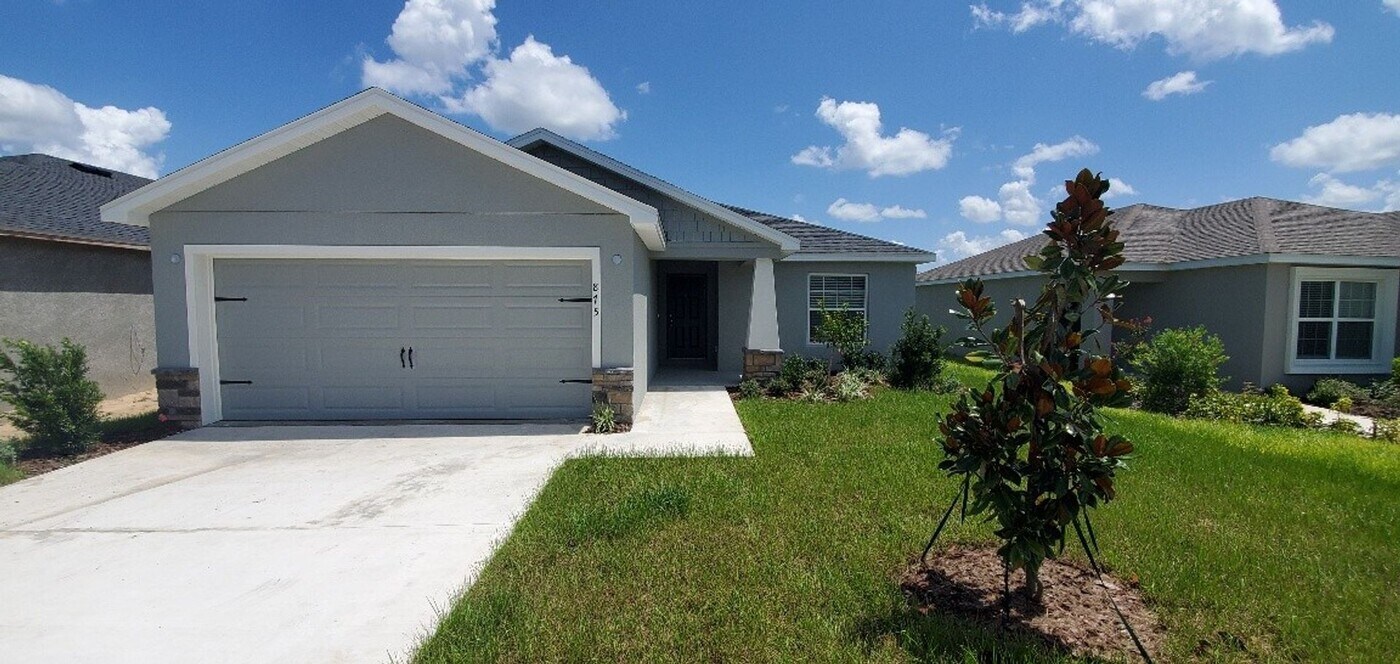 875 Orleans Dr in Eagle Lake, FL - Building Photo