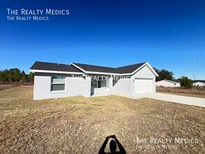 391 Malauka Loop in Ocklawaha, FL - Building Photo - Building Photo