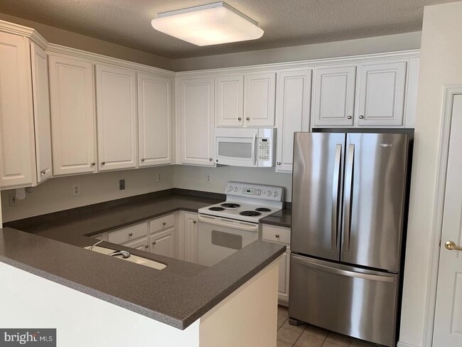 12161 Abington Hall Pl-Unit -304 in Reston, VA - Building Photo - Building Photo