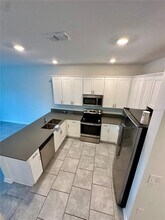 7477 Stone Crk Trl in Kissimmee, FL - Building Photo - Building Photo