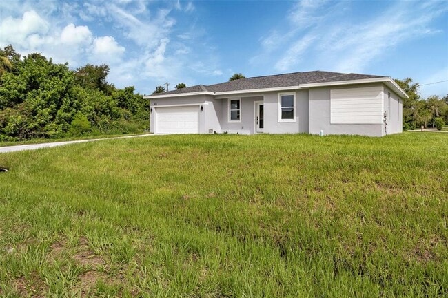 924 Tropical Ave NW in Port Charlotte, FL - Building Photo - Building Photo