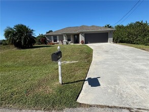 919 Chaplin Ave in Lehigh Acres, FL - Building Photo - Building Photo