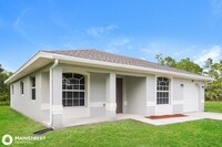 1877 Mettler Ave in Lehigh Acres, FL - Foto de edificio - Building Photo