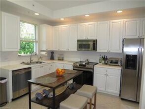 1435 Mariposa Cir-Unit -104 in Naples, FL - Building Photo - Building Photo