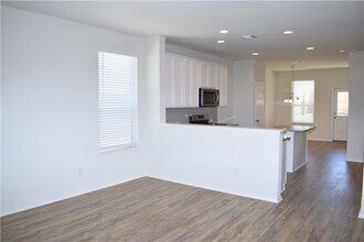 951 Pepperbark Loop in Mustang Ridge, TX - Building Photo - Building Photo