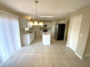 1569 Elkcam Blvd in Deltona, FL - Foto de edificio - Building Photo