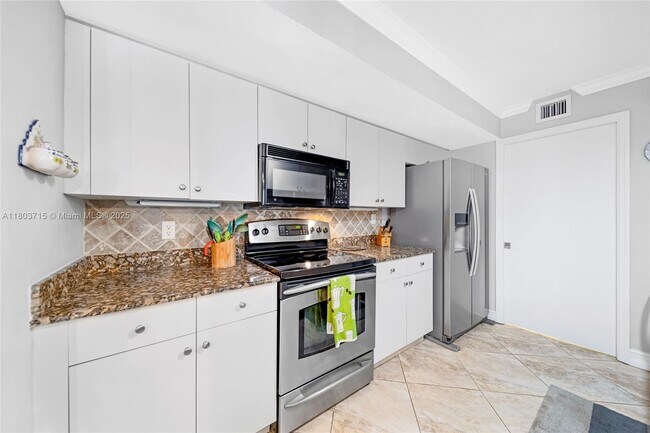 property at 6917 Collins Ave