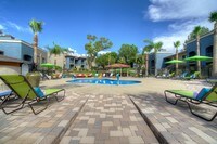 Kick back and relax poolside on our expansive sundeck. - Domain 3201 Apartments in Tucson, Arizona