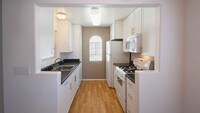 Kitchen with Dishwasher - Ridgewood Village Apartamentos in San Diego, California