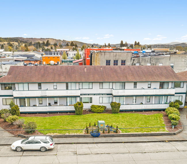 Village Green Apartments in Raymond, WA - Building Photo - Building Photo