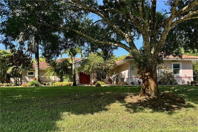 property at 4881 SW Lake Grove Cir