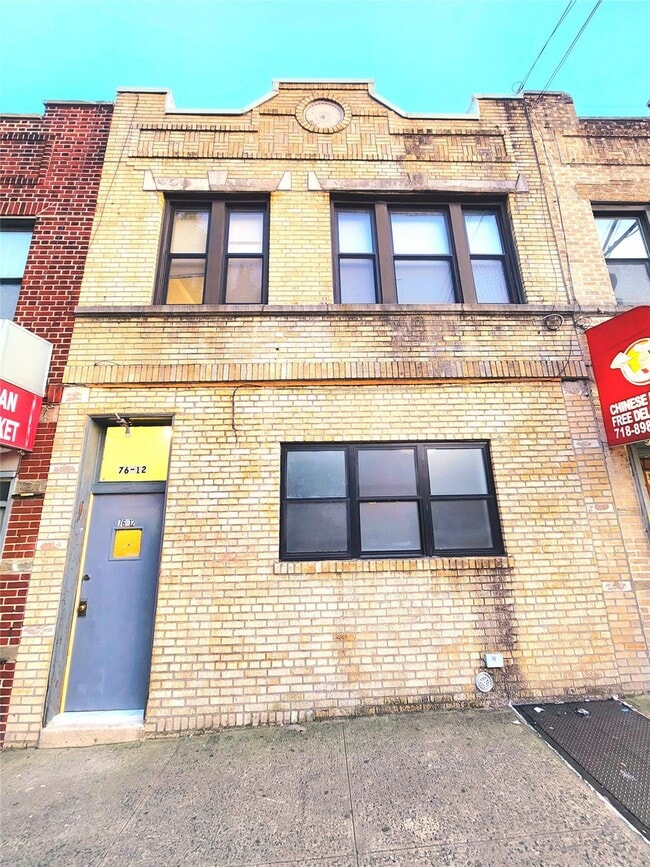 property at 76-12 Woodside Ave