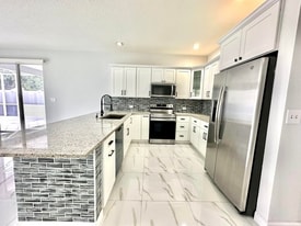 1219 Baycourt Isle in Greenacres, FL - Building Photo