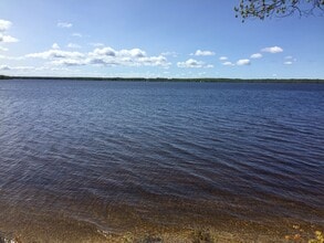 7990 Paradise Trl, Unit A in Carp Lake, MI - Foto de edificio - Building Photo