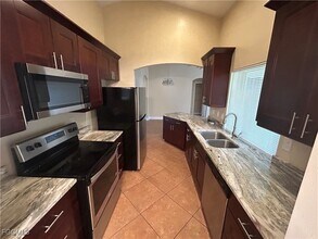 717 Foxtail St E in Lehigh Acres, FL - Building Photo - Building Photo