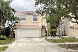 7594 Oak Grove Cir in Greenacres, FL - Building Photo