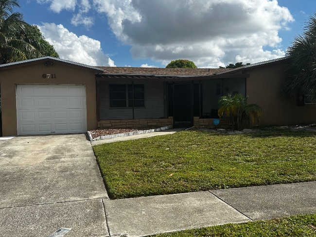 property at 6711 NW 1st Ct