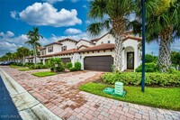 9451 Sardinia Way in Ft. Myers, FL - Foto de edificio - Building Photo