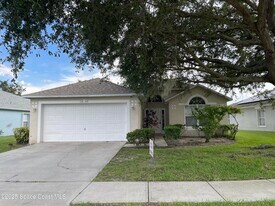 1642 Sawgrass Dr SW in Palm Bay, FL - Building Photo