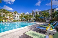 Relax under the sun at our resort-style pool. - The Laurels Apartment Homes in Ft. Myers, Florida
