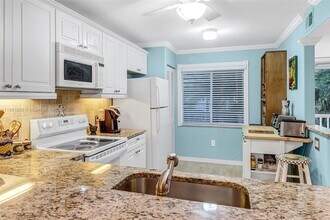 3041 Sandpiper Bay Cir, Unit 201 in Naples, FL - Building Photo - Building Photo