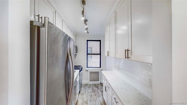property at 66-15 Wetherole St